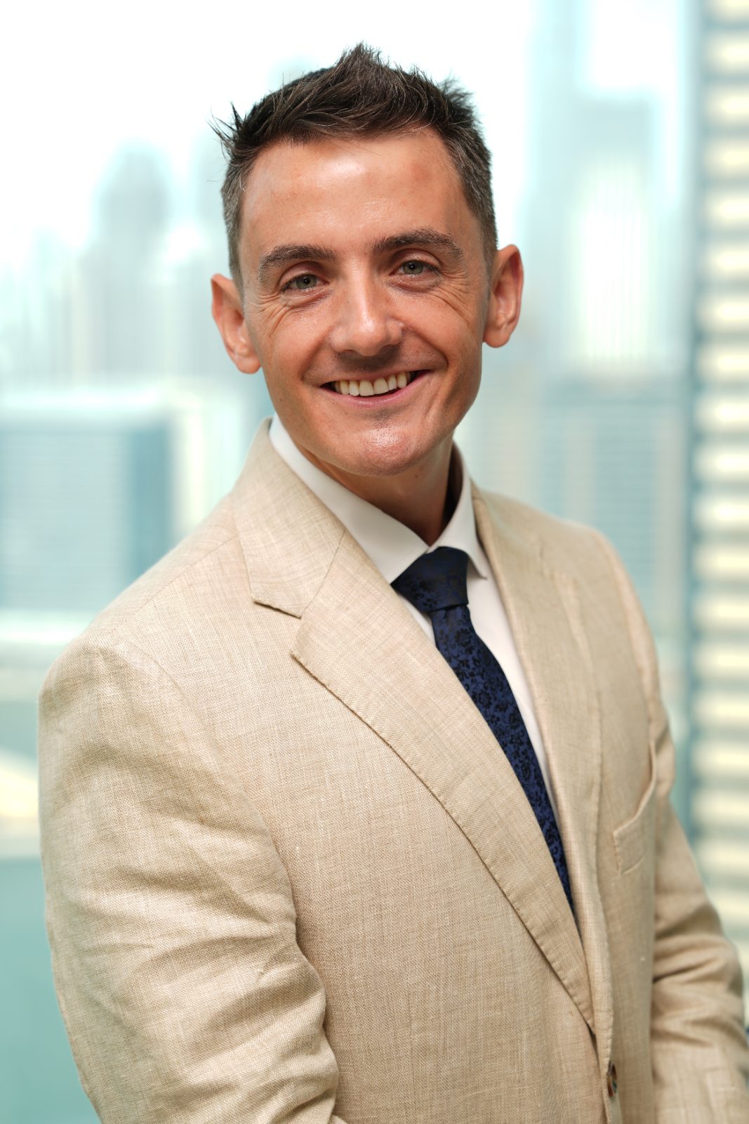 Kevin Walsh in front of the Dubai skyline